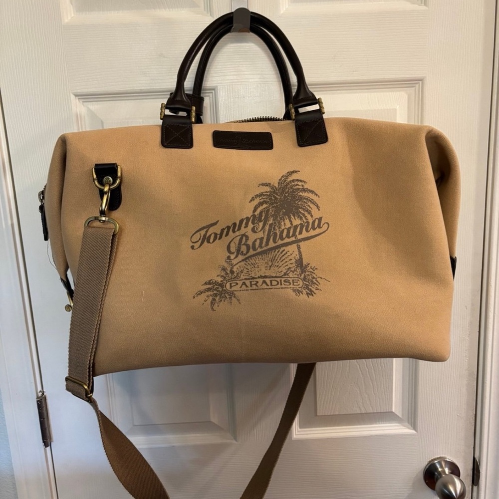 Tommy Bahama Taupe Canvas & Dark Brown
Leather Weekender Logo Duffle Bag